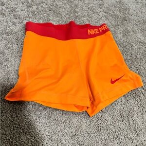 Nike Women's Athletic Shorts in Orange and Red